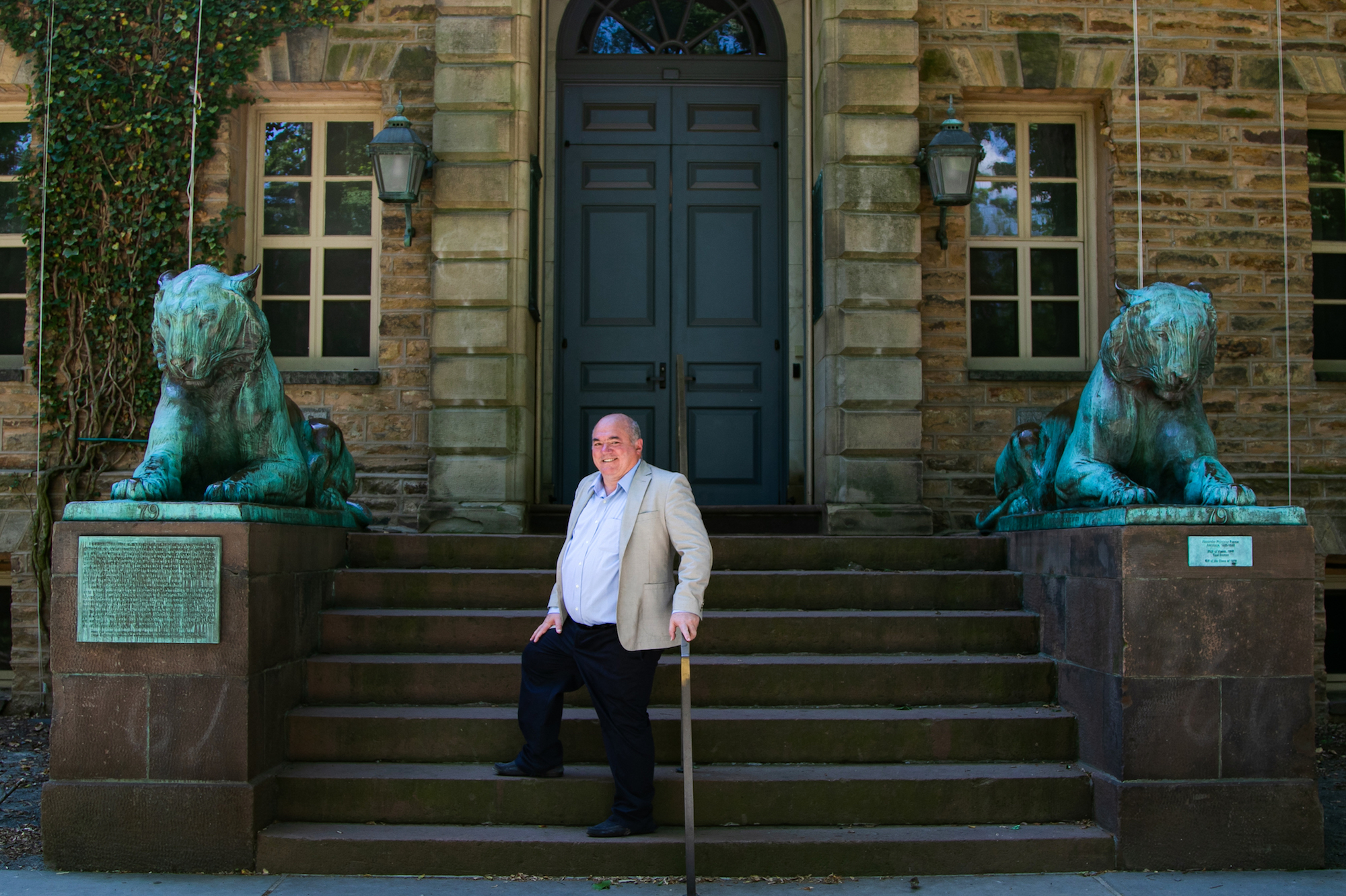 The founder of Network for Teaching Entrepreneurship (NFTE) Steve Mariotti stands on stairs in Princeton University in New Jersey on June 25, 2020. (Chung I Ho/The Epoch Times)
