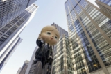 Bóng bay mang hình tượng của nhân vật Boss Baby đang đi xuống Đại lộ số Sáu trong Cuộc diễn hành Ngày Lễ Tạ Ơn của Macy ở New York hôm 24/11/2022. (Ảnh: Jeenah Moon/AP Photo)