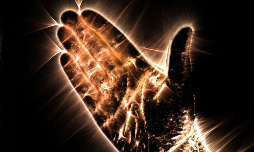 Kỹ thuật Kirlian chụp ảnh vầng hào quang cho thấy bàn tay của con người đang phát sáng. (MP_Foto/Shutterstock)