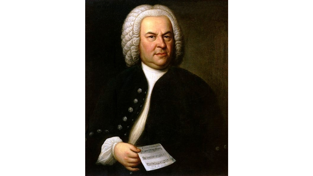 Nhà soạn nhạc Baroque Johann Sebastian Bach, 1746, tranh của họa sĩ Elias Gotlob Houssmann. Bach được miêu tả đang cầm bản thảo đến BWV 1076, đây cũng là bản canon thứ mười ba trong các bản Canon Goldberg. (Ảnh: Tài sản công)