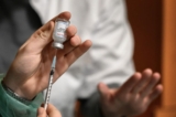 A COVID-19 vaccine is prepared in Switzerland on Dec. 14, 2021. (Fabrice Coffrini/AFP via Getty Images)