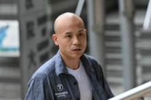 Kẻ côn đồ thân ĐCSTQ Hồ Ái Dân (Hu Aimin) bị kết án về hai cáo buộc hình sự và bị kết án 15 tuần tù. (Ảnh: Sung Pi-Lung/The Epoch Times)