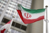 Cờ Iran tung bay trước trụ sở cơ quan giám sát hạt nhân của Liên Hiệp Quốc tại Vienna vào ngày 24/05/2021. (Ảnh: Lisi Niesner/Reuters)