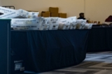 Những thùng hồ sơ được đặt qua một bên trong phòng xử lý lá phiếu khiếm diện ở Nhà thi đấu State Farm tại Atlanta, tiểu bang Georgia, vào ngày 02/11/2020. (Ảnh: Megan Varner/Getty Images)
