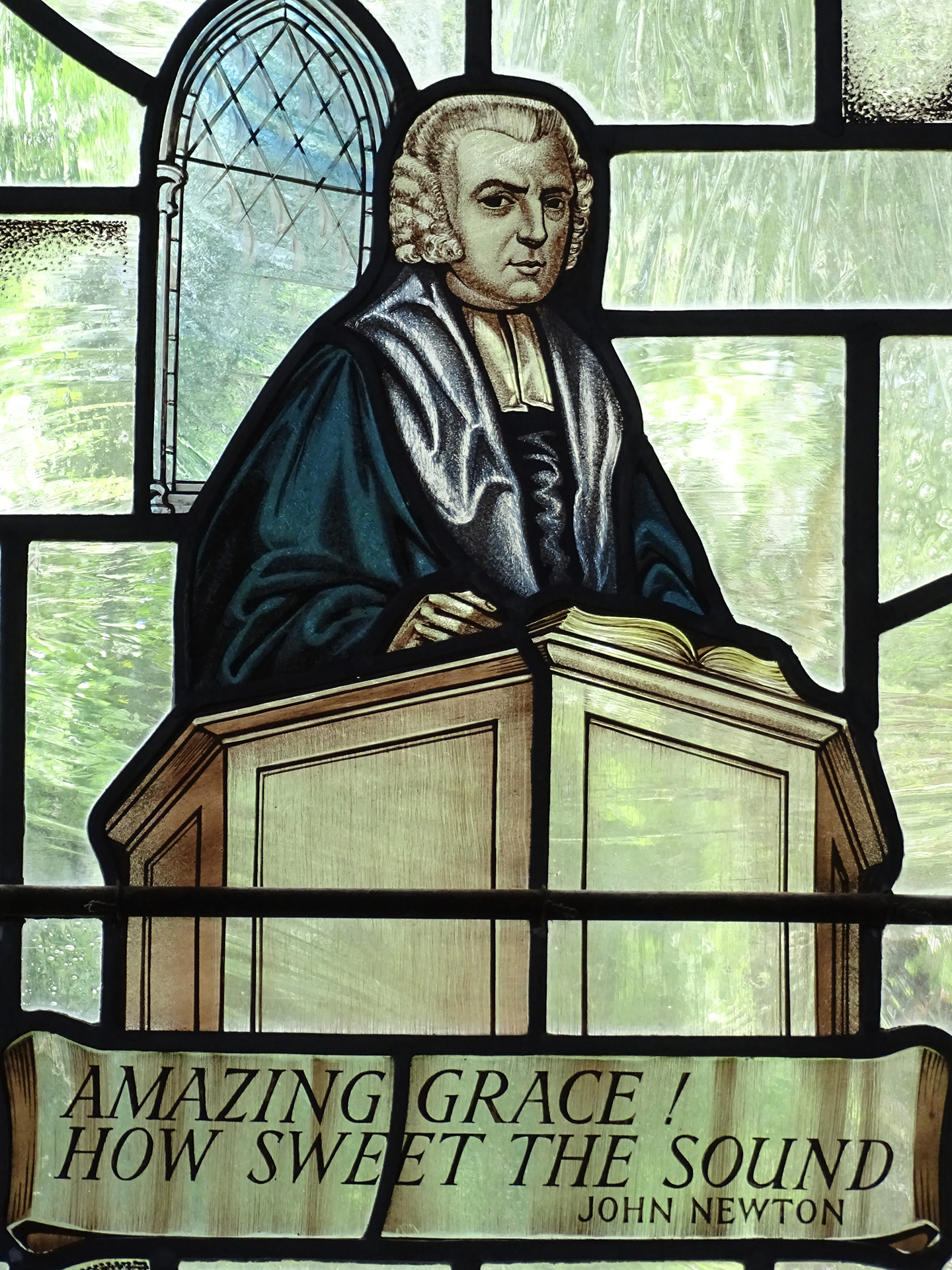 Cửa sổ kính màu có hình John Newton, tác giả bài hát “Ân điển diệu kỳ” ở Nhà thờ Thánh Peter và Paul, Buckinghamshire, Anh. (Ảnh: Adam Jones/CC BY-SA 2.0)
